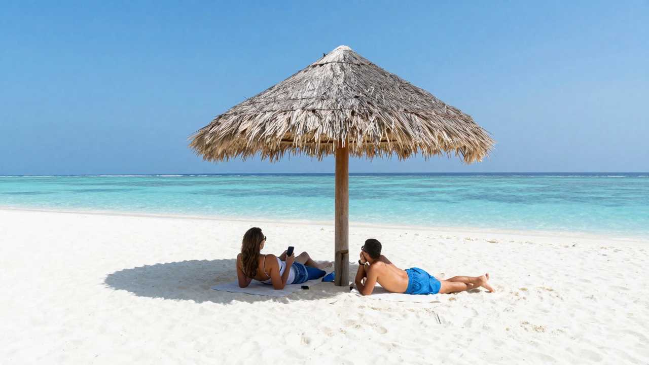Couple relaxing on Maldives white sand beach